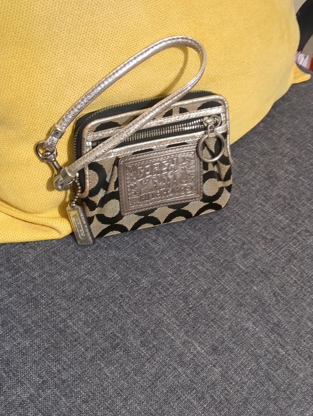 Coach Poppy Signature Wristlet in Black and Metallic Gold